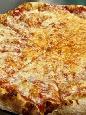 Our classic cheese pizza fresh our of the stone-bake oven