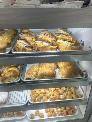 Croissant sandwich and doughnuts in the display for the day