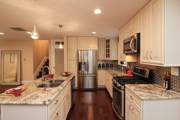 American Maple Solid Wood, Foil Glass Mosaic Tile and Bianco Antico Granite.