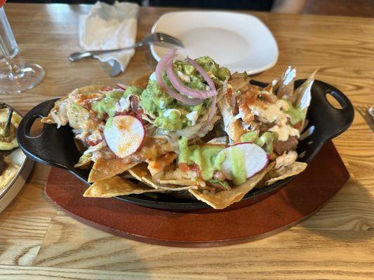 Super nachos, with chicken. Usually birria but we substituted