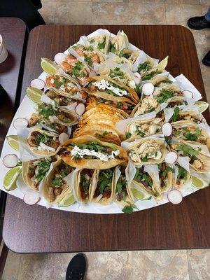 Shrimp, crab, scallops, steak, chicken tacos and in the middle amazing fried tacos