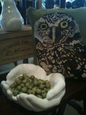 Latch hooked owl pillow and neat cupped Hans bowl holding fake crab apples...feels very Portland