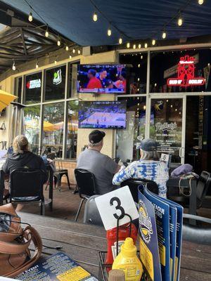 Outside seating with games on.