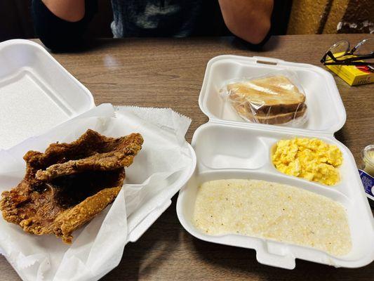 Fried pork chops, grits, scrambled eggs, toast. So good!