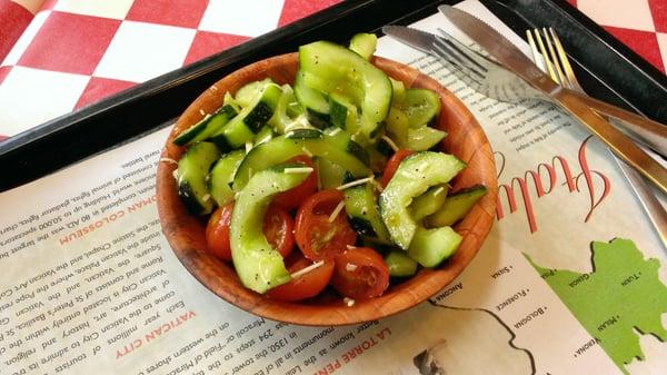 Nice cucumber salad with cherry tomatoes and mozzarella cheese.