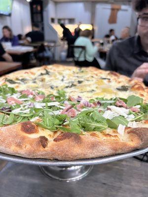 Half Arugula Pie and half spinach and artichoke pie