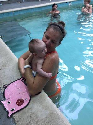 Julie helping our son enter the pool for the first time. She is big on safety and teaching them safe rules from day one.