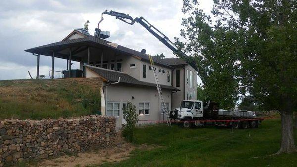 Loading shingles at our jobsite.