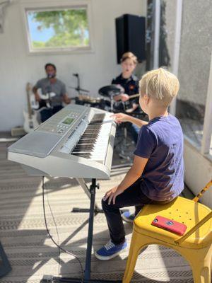 Teaching a music workshop with some students