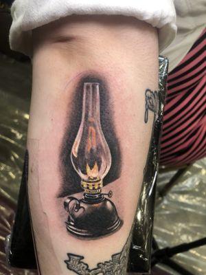 Realistic oil lamp! Thai tattoo was done at a convention in AK.