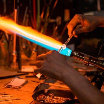 One of our experienced staff glassblowers creating an Icicle Ornament