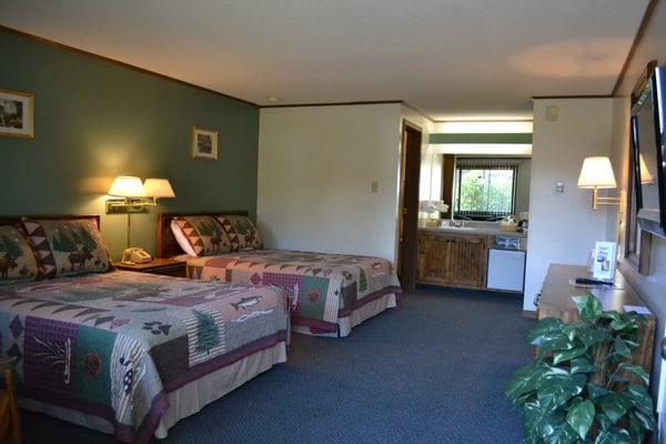 Deluxe Room, two double beds, coffee maker & 32 " flat screen tv, table with two chairs