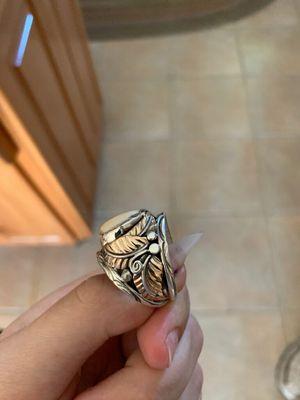 Side view of custom Elk tooth ring by Silversmith Herbert Tsosie