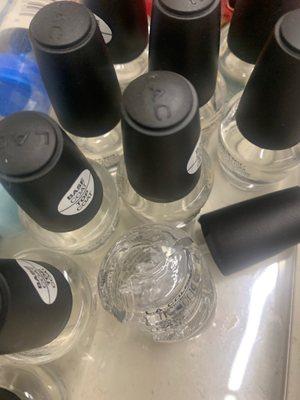 Broken nail polish bottle