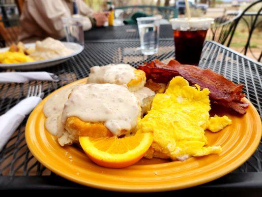 Biscuits and gravy with a side of bacon added on