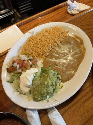 Beans and rice served with the 3 carne asada dinner