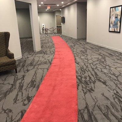 Red carpet leading to the conference room