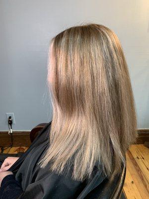 Blond with hint of pink highlights