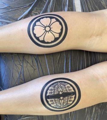 Japanese family crescents "Kamon" on calves using tattoo machine by owner/artist Paulo Manabe of HNL tattoo.