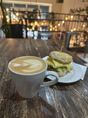 8oz oatmilk latte and a breakfast sandwich+avo