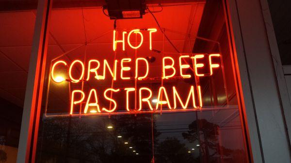 Hot Corned Beef Pastrami neon sign in front window