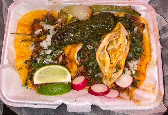 Birria Tacos with fried pablano pepper and onion shoots