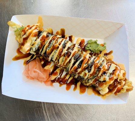 Razorback roll (shrimp tempura, cucumber, avocado eel sauce, spicy mayo and siraca sauce on top)