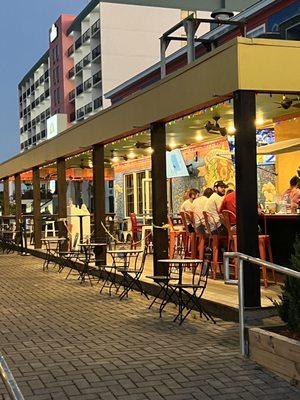 Side view of restaurant with outside bar (also an indoor bar as well)