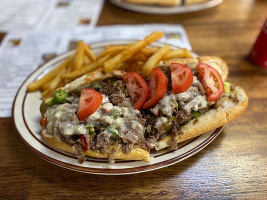 Supreme Cheesesteak with jalapeños and fries