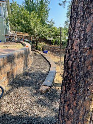 Retaining wall to help add walkways on a steep backyard hill