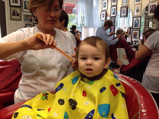 The boy gets a haircut from Mary at Diego's.