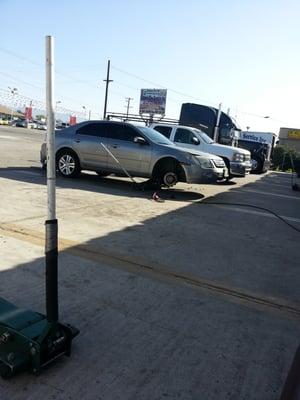 Employees working on cars