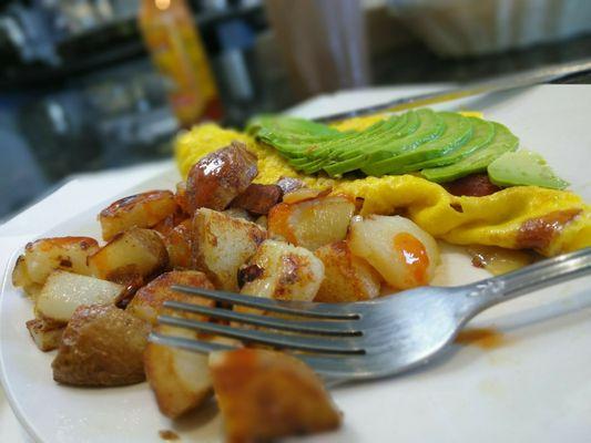 Morning omelette with sauteed potatoes. Light and hearty.