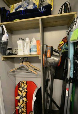 Small coat closet shelving in Hawaii condo.