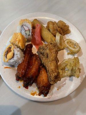 Sushi, "Buffalo wings", calamari, chicken wings, fried fish, and veggie spring roll