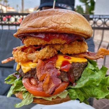 Wild West Burger
 
 Applewood-smoked bacon, onion rings, bbq sauce, cheddar cheese, lettuce, tomato, and mayo.