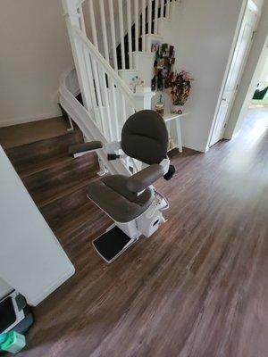 custom curved stairlift with brown upholstery upgrade option