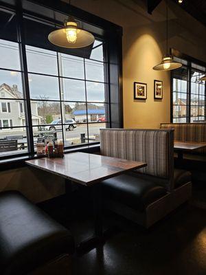 The booths that line the windows of the restaurant.