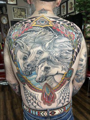 back piece by Johnny Williams.  A fun mix of styles for a striking Tattoo.