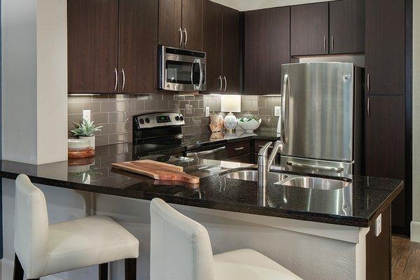 Chef's kitchen featuring GE® stainless steel appliances