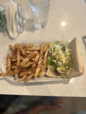 Jerk Chicken Parmesan Sandwich with Jerk Chicken french fries.