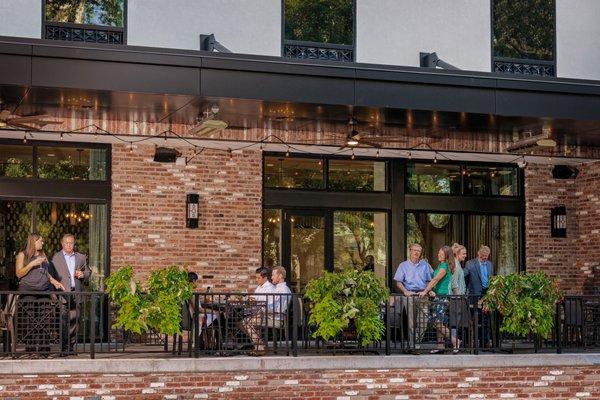 Enjoy a drink (or two) at our Happy Hour on the 'Front Porch' overlooking Bienville Square.