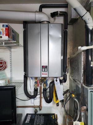 Rinnai tankless gas water heater. Saves space in our packed garage and works great!