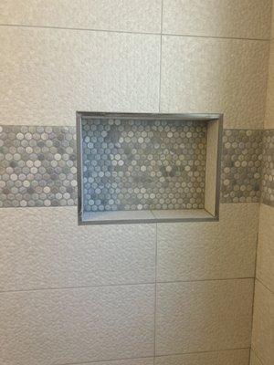 Amazing the penny tiles are flush could not be happier with the results