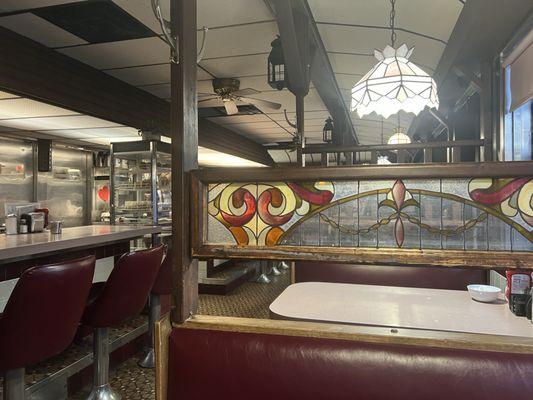 Stained glass dividers between booths