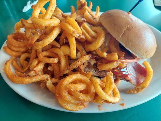 Bricks Burger 1/2 # with bacon, barbecue sauce, coleslaw. They don't skimp on curly fries.