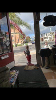 My grandson sweeping