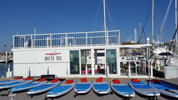 Water Dog's Floating Yoga Studio houseboat and boards