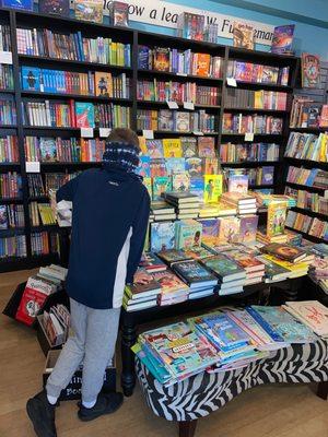 My son looking at the children's section