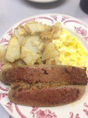 Scrambled eggs potatoes and hot sausage